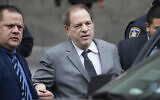 Harvey Weinstein, center, leaves court following a bail hearing on December 6, 2019 in New York. (AP Photo/Mark Lennihan)