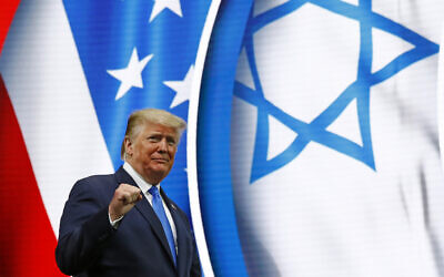 US President Donald Trump walks onstage to speak at the Israeli American Council National Summit in Hollywood, Florida, December 7, 2019. (Patrick Semansky/AP)