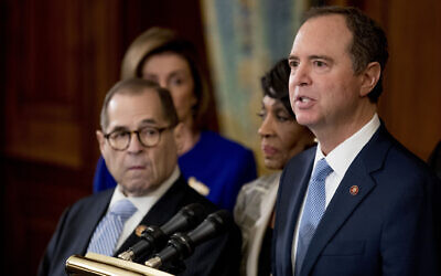 Democratic Representative Adam Schiff of California, chairman of the House Intelligence Committee, right, speaks with from left Chairman of the House Judiciary Committee Jerrold Nadler, a New York Democrat, House Speaker Nancy Pelosi and Chairwoman of the House Financial Services Committee Maxine Waters, a California Democrat, second from right, during a news conference to unveil articles of impeachment against President Donald Trump, abuse of power and obstruction of Congress, December 10, 2019, on Capitol Hill in Washington. (AP Photo/Andrew Harnik)