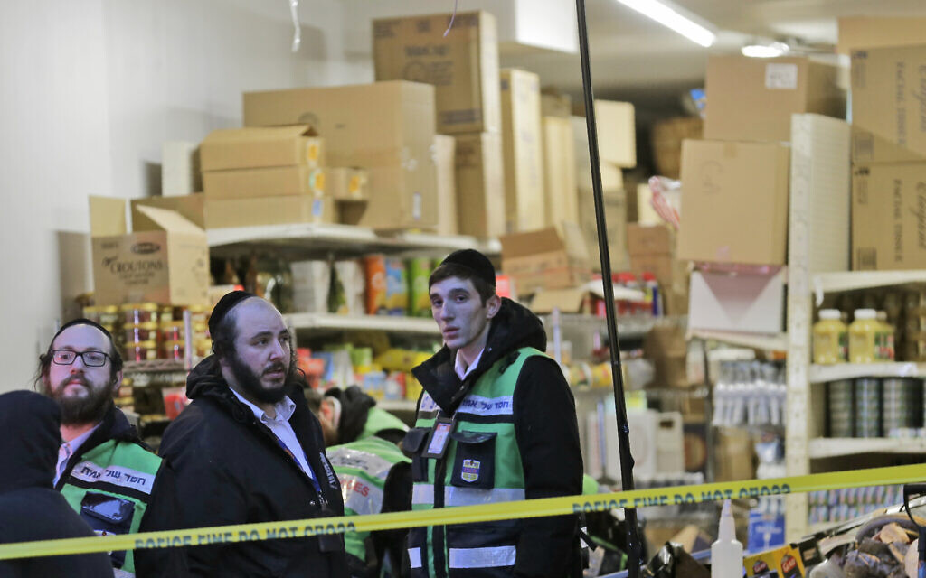 Emergency responders work at a kosher supermarket, the site of a shooting in Jersey City, New Jersey, December 11, 2019. (AP Photo/Seth Wenig) Emergency responders work at a kosher supermarket, the site of a shooting in Jersey City, New Jersey, December 11, 2019. (AP Photo/Seth Wenig)