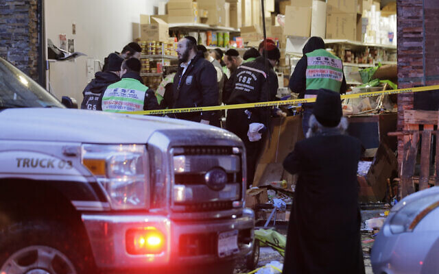 Emergency responders work at a kosher supermarket, the site of a shooting in Jersey City, N.J., Wednesday, December 11, 2019. (AP/Seth Wenig) Emergency responders work at a kosher supermarket, the site of a shooting in Jersey City, N.J., Wednesday, December 11, 2019. (AP/Seth Wenig)