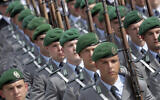Soldiers attend an oath-taking ceremony of the German army at the Defence Ministry in Berlin, Germany, July 20, 2019. (AP Photo/Michael Sohn)