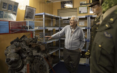 In this photo taken on November 7, 2019, Marcel Schmetz shows the motor of a crashed World War II Marauder B-26 at the Remember Museum 39-45 in Thimister-Clermont, Belgium. (AP Photo/Virginia Mayo)