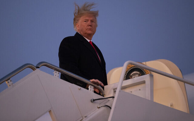 US President Donald Trump boards Air Force One for a campaign rally in Battle Creak, Mich., Wednesday, Dec. 18, 2019, in Andrews Air Force Base, Md. (AP Photo/ Evan Vucci) US President Donald Trump boards Air Force One for a campaign rally in Battle Creak, Mich., Wednesday, Dec. 18, 2019, in Andrews Air Force Base, Md. (AP Photo/ Evan Vucci)