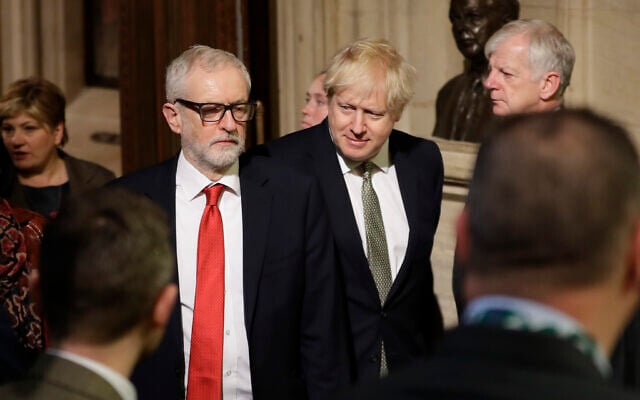 Britain's Prime Minister Boris Johnson (center right) and opposition Labour Party Leader Jeremy Corbyn walk through the Commons Members Lobby during the state opening of Parliament, in London, December 19, 2019. (AP Photo/Kirsty Wigglesworth, Pool) Britain's Prime Minister Boris Johnson (center right) and opposition Labour Party Leader Jeremy Corbyn walk through the Commons Members Lobby during the state opening of Parliament, in London, December 19, 2019. (AP Photo/Kirsty Wigglesworth, Pool)