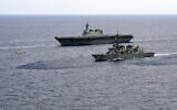 In this June 28, 2019, file photo, Japan's Maritime Self-Defense Force helicopter carrier Izumo (DDH-183) and destroyer JS Murasame (DD-101) participate in drills that included maritime navigation and emergency response exercises in Sulu Sea. (AP/Emily Wang)