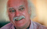 In an October 21, 1998, file photo, Ram Dass, best known for the 1971 bestseller 'Be Here Now,' smiles during an interview at his San Anselmo, California, home (AP Photo/Susan Ragan, File)