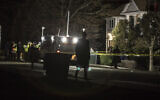 Authorities and first responders gather in front of a residence in Monsey, New York, Sunday, December 29, 2019, following a stabbing spree late Saturday during a Hanukkah celebration in a rabbi's home. (AP Photo/Allyse Pulliam)