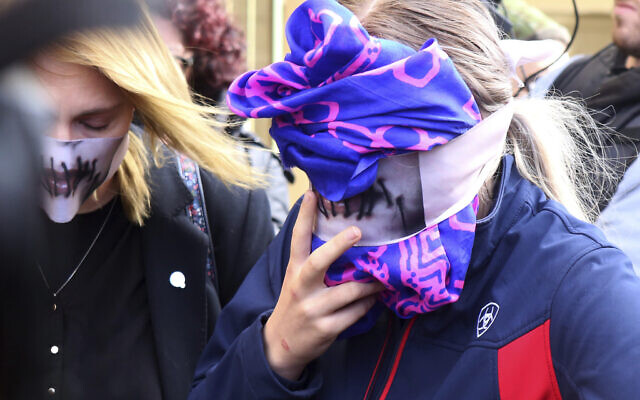 A 19-year old British woman, right, covers her face as she leaves from the Famagusta court after her trial, in Paralimni, Cyprus, Monday, Dec. 30, 2019. (AP/Philippos Christou) A 19-year old British woman, right, covers her face as she leaves from the Famagusta court after her trial, in Paralimni, Cyprus, Monday, Dec. 30, 2019. (AP/Philippos Christou)