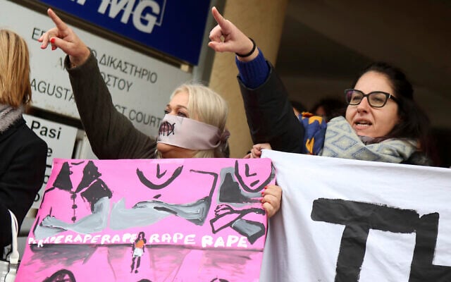 Protesters stage a demonstration outside a court house in Paralimni, Cyprus on December 30, 2019, in support of a 19 year-old British woman who was found guilty of fabricating claims that she was gang raped by 12 Israelis. (AP Photo/Philippos Christou) Protesters stage a demonstration outside a court house in Paralimni, Cyprus on December 30, 2019, in support of a 19 year-old British woman who was found guilty of fabricating claims that she was gang raped by 12 Israelis. (AP Photo/Philippos Christou)