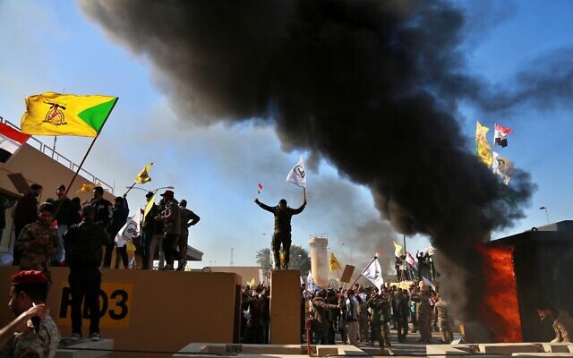 Protesters burn property in front of the US embassy compound, in Baghdad, Iraq, Dec. 31, 2019. (Khalid Mohammed/AP) Protesters burn property in front of the US embassy compound, in Baghdad, Iraq, Dec. 31, 2019. (Khalid Mohammed/AP)