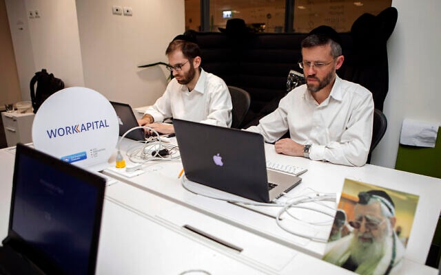 Illustrative: Ultra-Orthodox Jewish men work at a high tech start-up in an office in Tel Aviv, on March 15, 2016. (AP Photo/Dan Balilty) Illustrative: Ultra-Orthodox Jewish men work at a high tech start-up in an office in Tel Aviv, on March 15, 2016. (AP Photo/Dan Balilty)