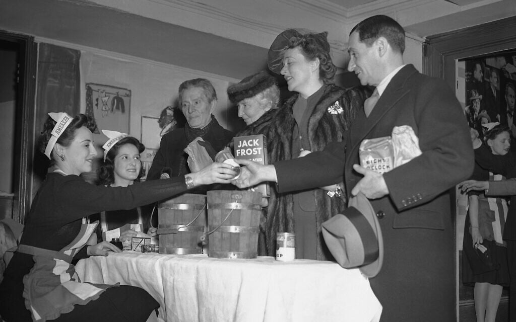 Left to right: Mary Stevenson and Allyn Van Baalen, hostesses; Morris Gest, producer; Rachel Crothers, playwright; Jessie Royce Landis, actress, and Irving Berlin, song writer, at the Stage Door canteen at an event for US soldiers, February 28, 1942. (AP Photo/Marty Zimmerman)