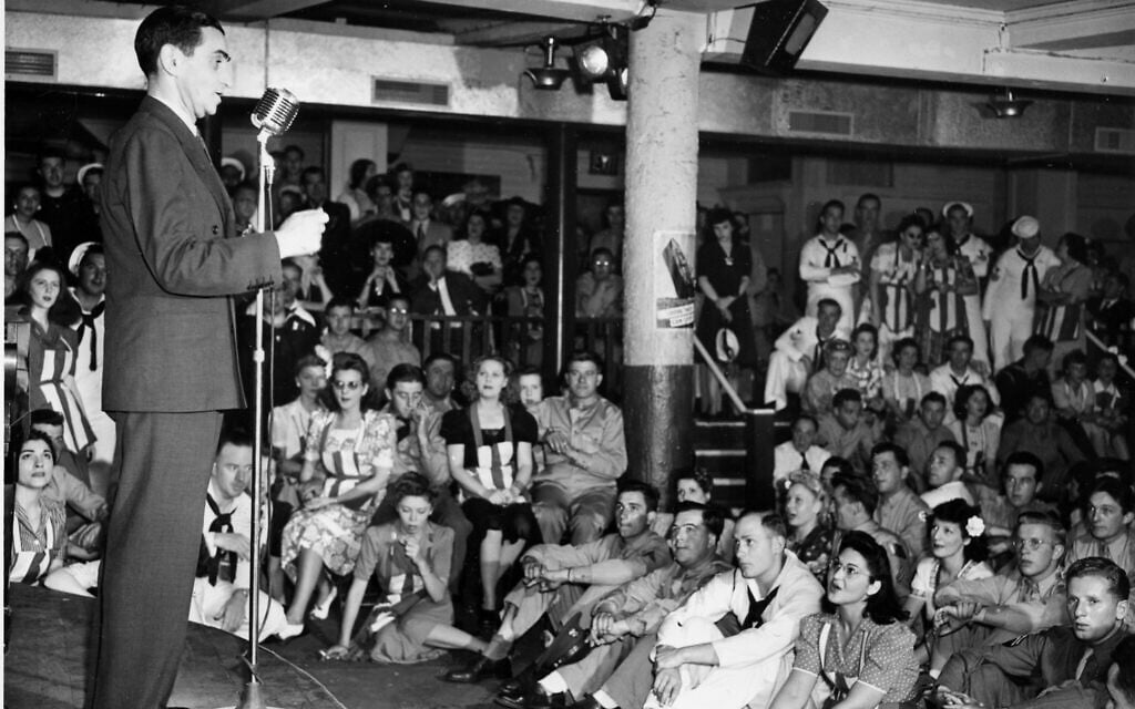 Composer Irving Berlin sings his song 'God Bless America' for service men at the Stage Door Canteen in New York City, July 9, 1942. (AP Photo)