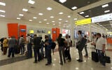 Illustrative: Passengers stand waiting at Sheremetyevo Airport in Moscow, June 27, 2013. (Sergei Grits/AP)