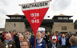 Members of the international Mauthausen committee arrive for a ceremony to commemorate the 70th anniversary of the liberation of the Nazi concentration camp in Mauthausen, Austria, Sunday, May 10, 2015. . (AP Photo/Ronald Zak)