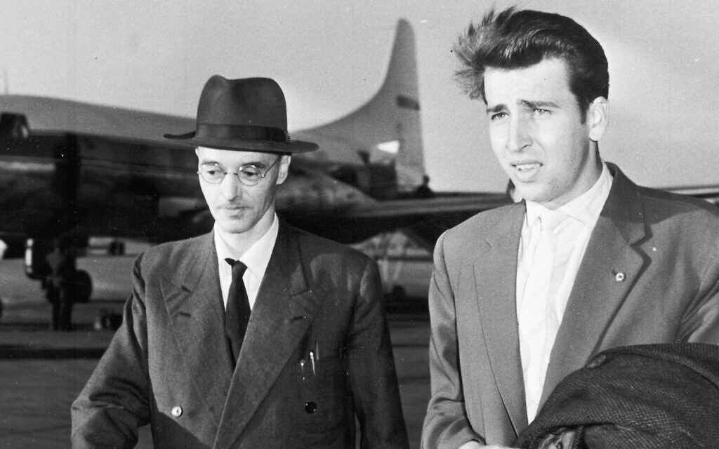 Illustrative: Former spy Klaus Fuchs, left, walks across the tarmac at Schoenefeld Airport, East Berlin, on June 23, 1959, after his arrival in a Polish airliner, accompanied by his nephew, Klaus Kittowski. Fuchs was released from Wakefield Prison after serving nine-and-a-half years of a 14-year sentence, for passing British and American secrets to the Soviet Union. (AP Photo)