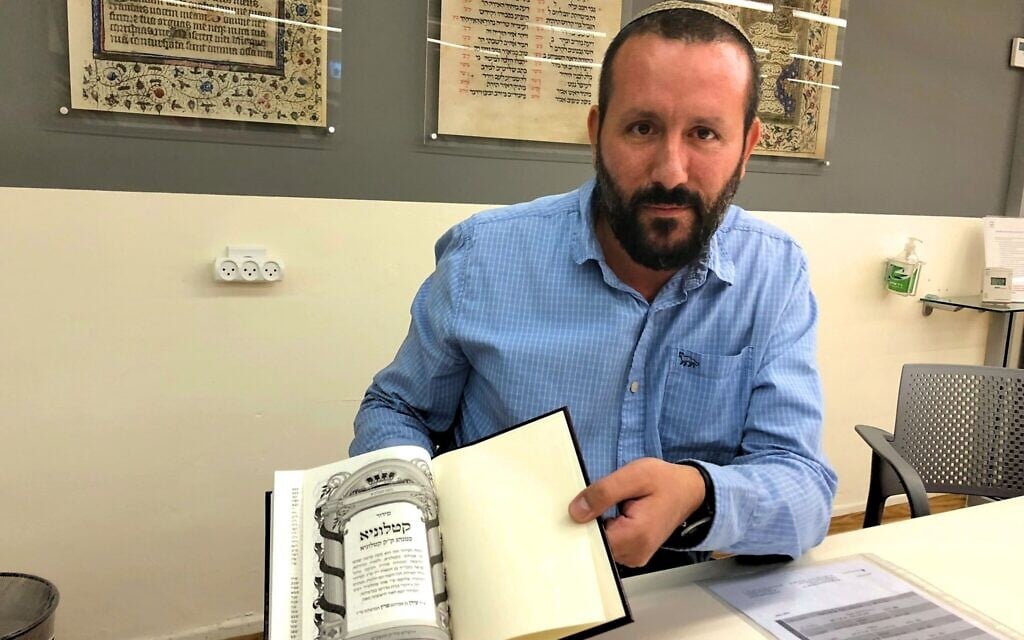 Dr. Idan Perez holds the 'Siddur Catalunya,' a reconstruction of the prayer book used in parts of pre-Expulsion Catalonia, at Jerusalem's National Library, September 15, 2019. (Amanda Borschel-Dan/Times of Israel) Dr. Idan Perez holds the 'Siddur Catalunya,' a reconstruction of the prayer book used in parts of pre-Expulsion Catalonia, at Jerusalem's National Library, September 15, 2019. (Amanda Borschel-Dan/Times of Israel)