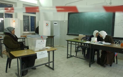 In this 9 January 2005 file photo, Palestinian women guard the ballot boxes for the Palestinian Authority Election. ( Sharon Perry/Flash90)