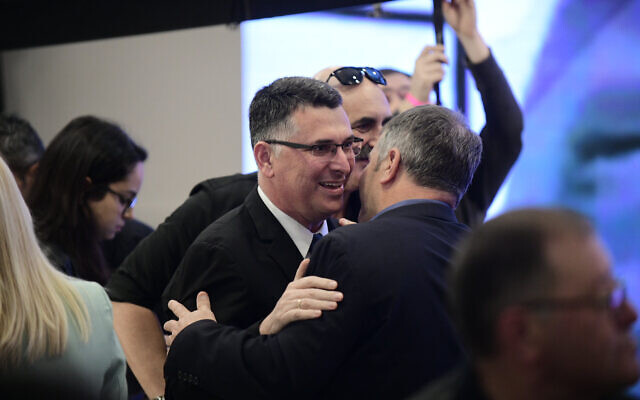 Likud MK Gideon Saar (L) embracing MK Yoav Kisch at a party conference in Ramat Gan, March 4, 2019. (Tomer Neuberg/Flash90) Likud MK Gideon Saar (L) embracing MK Yoav Kisch at a party conference in Ramat Gan, March 4, 2019. (Tomer Neuberg/Flash90)