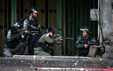 Israeli security forces clash with Palestinian protesters in the West Bank city of Hebron on December 9, 2019.  (Wisam Hashlamoun/Flash90)