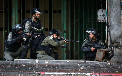 Israeli security forces clash with Palestinian protesters in the West Bank city of Hebron on December 9, 2019.  (Wisam Hashlamoun/Flash90)