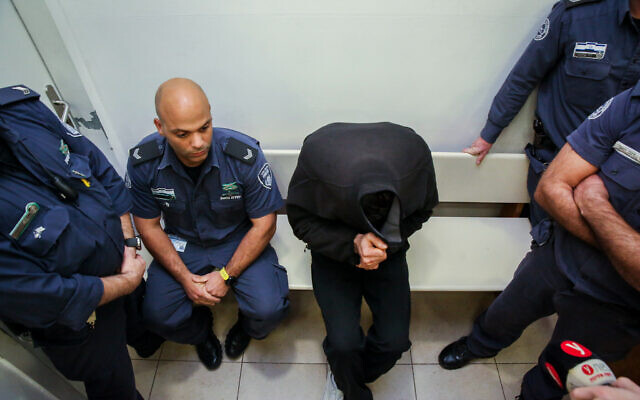 Yonatan Fadida, 29, the driver who allegedly killed two cyclists in a traffic accident arrives for a court hearing at the Petah Tikva Magistrate's Court, December 17, 2019. (Flash90) Yonatan Fadida, 29, the driver who allegedly killed two cyclists in a traffic accident arrives for a court hearing at the Petah Tikva Magistrate's Court, December 17, 2019. (Flash90)