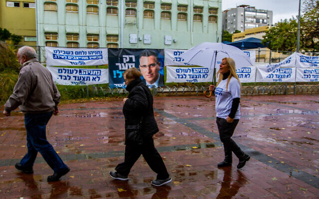 Likud party members arrive at a voting station to cast their vote in the Likud party primaries for the Likud leadership, in Rishon Lezion, on December 26, 2019. (Flash90) Likud party members arrive at a voting station to cast their vote in the Likud party primaries for the Likud leadership, in Rishon Lezion, on December 26, 2019. (Flash90)