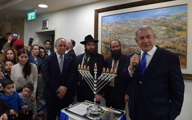 Prime Minister Benjamin Netanyahu (R) speaks at a Hanukkah candle-lighting event at the Prime Minister's Office in Jerusalem, December 29, 2019. (Kobi Gideon/GPO) Prime Minister Benjamin Netanyahu (R) speaks at a Hanukkah candle-lighting event at the Prime Minister's Office in Jerusalem, December 29, 2019. (Kobi Gideon/GPO)