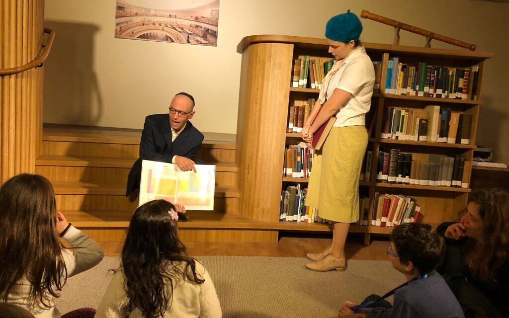 Siblings Yeshayahu and Nechama Leibowitz disagree over the existence of ghosts at the National Library's Night in the Library Hanukkah program, December 23, 2019. (Amanda Borschel-Dan/Times of Israel)