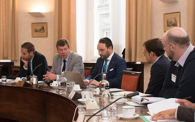 Michael Freilich, center, wearing a kippah, attends a meeting with federal lawmakers and pro-Palestinian activists in Brussels, Belgium, Nov, 7, 2019. (Inge Verhelst/Belgian Federal Parliament via JTA) Michael Freilich, center, wearing a kippah, attends a meeting with federal lawmakers and pro-Palestinian activists in Brussels, Belgium, Nov, 7, 2019. (Inge Verhelst/Belgian Federal Parliament via JTA)