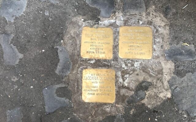 Stolperstein Holocaust memorials, or stumbling stones, in front of an apartment building in the Rome Ghetto. (Marcy Oster via JTA) Stolperstein Holocaust memorials, or stumbling stones, in front of an apartment building in the Rome Ghetto. (Marcy Oster via JTA)