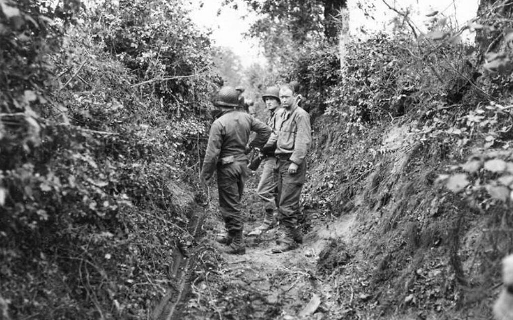 The bocage landscape of Normandy was defined by dense hedgerows surrounding agricultural fields; woody plants rooted in the earthen berm surrounding each field. German troops converted hedgerows into natural fortresses, keeping woody vegetation untrimmed to obscure lines of fire and to camouflage German artillery and snipers. (US Army/ Sumner)