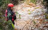 Rescue teams search for a teen boy who was caught in a flood near the northern village of Yarka, December 26, 2019. (Meir Vaknin/Flash90)