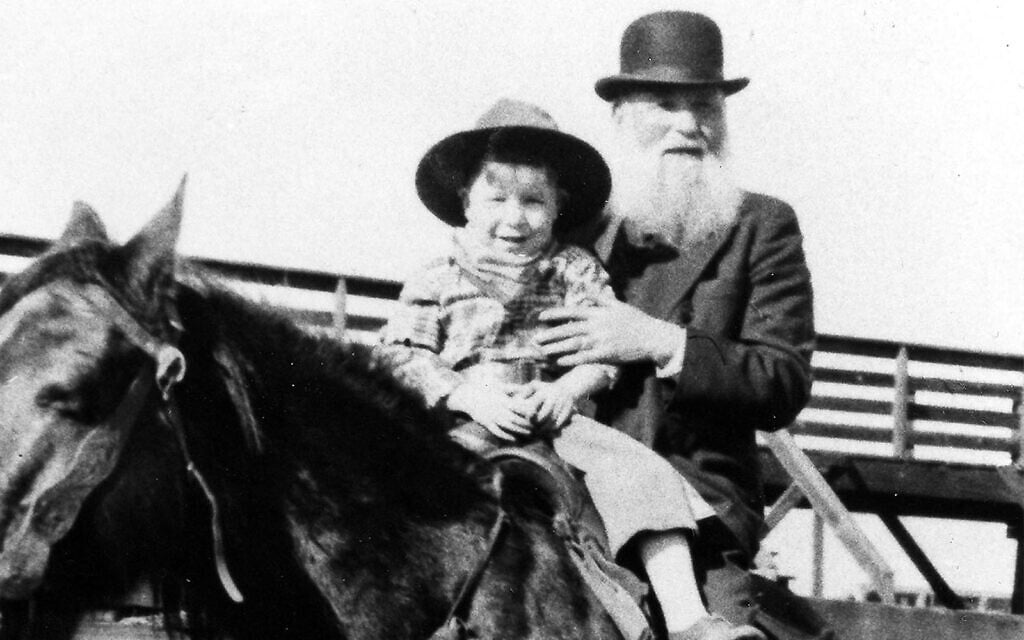 Jewish cattle rancher Robert Lazar Miller on horseback with his grandson at the Denver Stockyards, 1932. (Beck Archives, Special Collections, University of Denver Libraries via JTA)