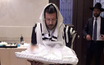 Yitzhak Meir Weiss and his son shortly after his birth. (Courtesy)