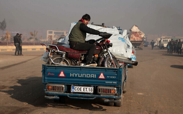Syrians carrying their belongings drive toward the northern areas of Syria's Idlib province near the Syrian-Turkish border as they flee the bombardments in the southern areas of the country's last major opposition bastion, December 20, 2019. (Aaref Watad/AFP) Syrians carrying their belongings drive toward the northern areas of Syria's Idlib province near the Syrian-Turkish border as they flee the bombardments in the southern areas of the country's last major opposition bastion, December 20, 2019. (Aaref Watad/AFP)