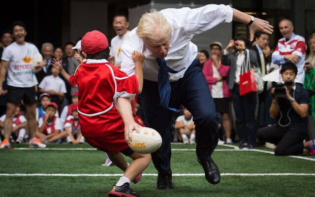 Boris Johnson takes part in a Street Rugby tournament in a Tokyo street, Oct. 15, 2015. (Stefan Rousseau/PA via AP) Boris Johnson takes part in a Street Rugby tournament in a Tokyo street, Oct. 15, 2015. (Stefan Rousseau/PA via AP)