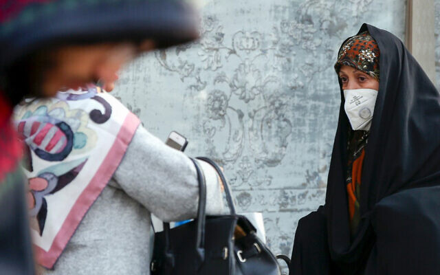 An Iranian woman wears a breathing mask due to pollution levels in Tehran, December 15, 2019. (STR/AFP) An Iranian woman wears a breathing mask due to pollution levels in Tehran, December 15, 2019. (STR/AFP)