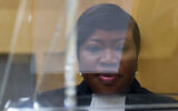 ICC prosecutor Fatou Bensouda is seen through a plexiglass lectern in the court room of the International Criminal Court, in The Hague, Netherlands, September 29, 2015. (AP Photo/Peter Dejong, Pool)