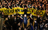 Liliana Segre, an 89-year-old Auschwitz survivor and senator-for-life, center, attends an anti-racism demonstration in Milan's Victor Emmanuel II arcade in northern Italy joined by mayors of some 600 Italian towns, December 10, 2019. (AP Photo/Luca Bruno)