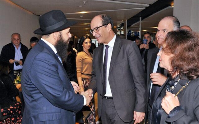 Rabbi Levi Banon greets Moroccan official Said Ahmidouch and his wife at a Hannukah celebration in Casablanca, Morocco, December 22, 2019. (Courtesy/Chabad.org) Rabbi Levi Banon greets Moroccan official Said Ahmidouch and his wife at a Hannukah celebration in Casablanca, Morocco, December 22, 2019. (Courtesy/Chabad.org)