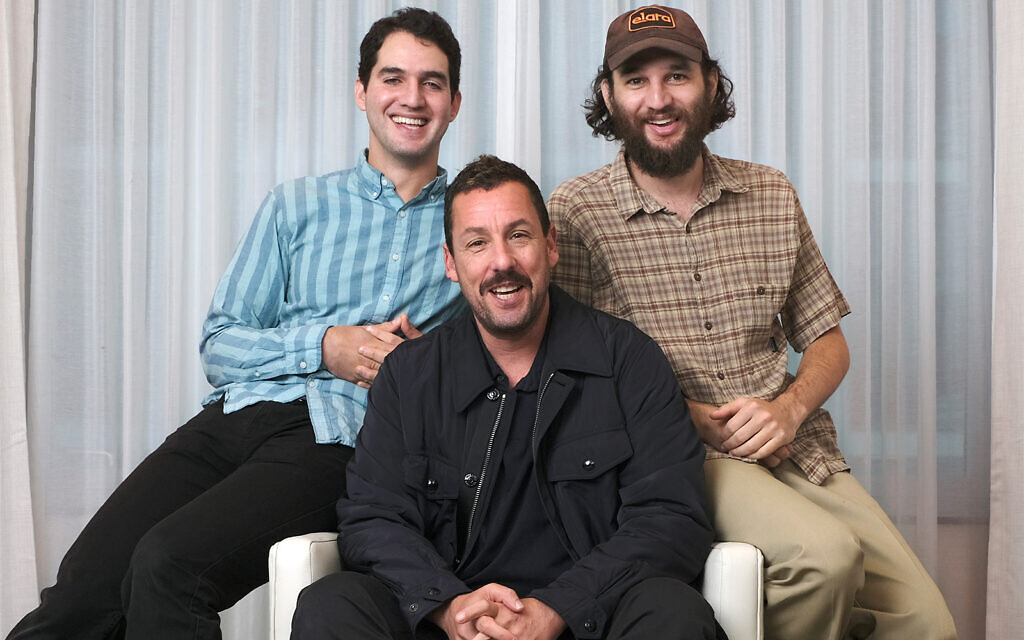 Adam Sandler, center, star of the film 'Uncut Gems,' with co-directors Benny Safdie, left, and his brother Josh at the St. Regis Hotel during the Toronto International Film Festival in Toronto, September 9, 2019. (Photo by Chris Pizzello/Invision/AP) Adam Sandler, center, star of the film 'Uncut Gems,' with co-directors Benny Safdie, left, and his brother Josh at the St. Regis Hotel during the Toronto International Film Festival in Toronto, September 9, 2019. (Photo by Chris Pizzello/Invision/AP)