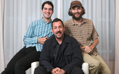 Adam Sandler, center, star of the film 'Uncut Gems,' with co-directors Benny Safdie, left, and his brother Josh at the St. Regis Hotel during the Toronto International Film Festival in Toronto, September 9, 2019. (Photo by Chris Pizzello/Invision/AP)