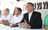 (From R-L) Former Likud MK Gideon Sa'ar and Samaria Regional Council chairman Yossi Dagan at a protest tent outside the prime minister's residence in Jerusalem on October 29, 2017. (Miri Tzachi)