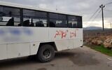 A bus used to transport Border Police officers to the Kumi Ori outpost near Yitzhar spray-painted with the phrase "go [join] the enemy" on December 8, 2019. (Border Police)