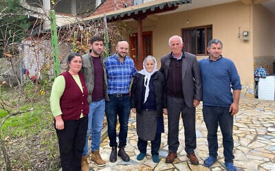Jonny Daniels, third from left, with the Bicaku family in their home in Durres, Albania, Dec. 11, 2019. (Courtesy of From the Depths)