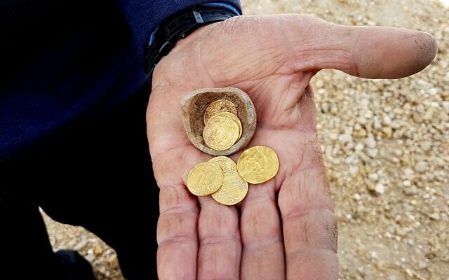Five ancient gold coins from the Earlier Islamic Period 7th-9th centuries CE, found at a dig in Yavne, central Israel, December 2019. (Liat Nadav-Ziv/Israel Antiquities Authority) Five ancient gold coins from the Earlier Islamic Period 7th-9th centuries CE, found at a dig in Yavne, central Israel, December 2019. (Liat Nadav-Ziv/Israel Antiquities Authority)