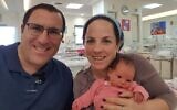 Tzippi Rimel (R) with her husband Ephraim and three-week-old daughter Noam. (Courtesy)