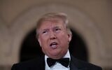 US President Donald Trump speaks to the press outside the grand ballroom as he arrives for a New Year's celebration at Mar-a-Lago in Palm Beach, Florida, on December 31, 2019. (JIM WATSON/AFP)